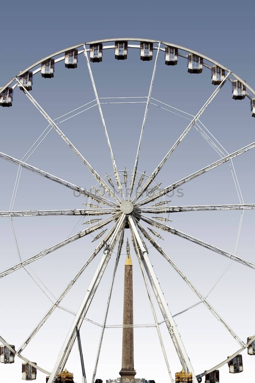 Paris,France – December 29,2013: The Ferris wheel on Place de la Concorde with the obelisk of Luxor in the background on December 29,2013 in Paris.