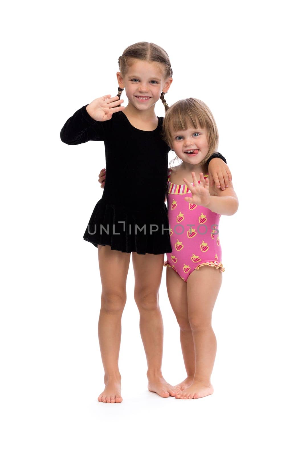 Two cute Ballerinas. Isolated on a white background. Studio shot.