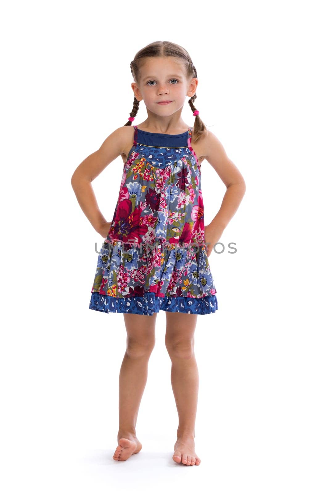 Girl in colorful dress in the studio, isolated on white background.