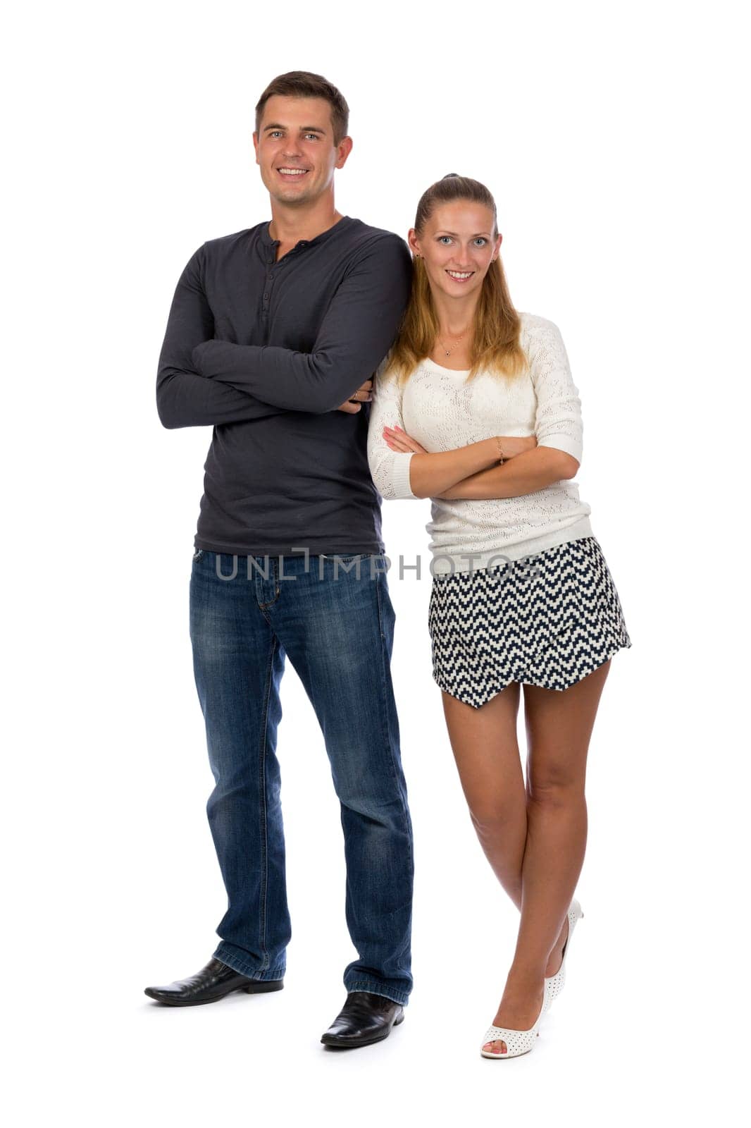Beautiful young couple in love to his full height, isolate on white.