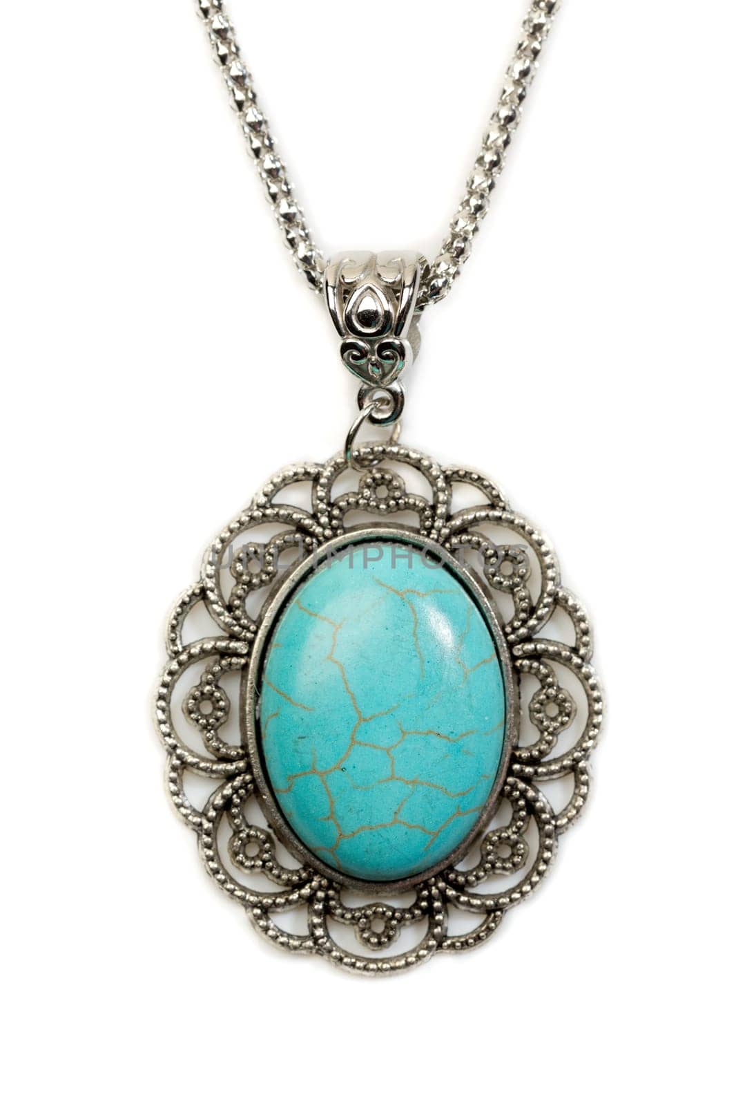 Oval pendant with turquoise stone in a silver frame. Isolate on white.