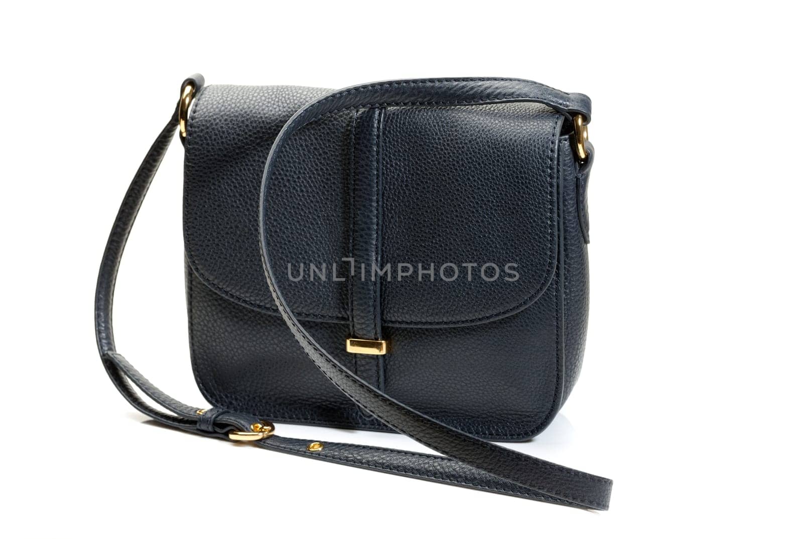 Luxury female handbag over white background.