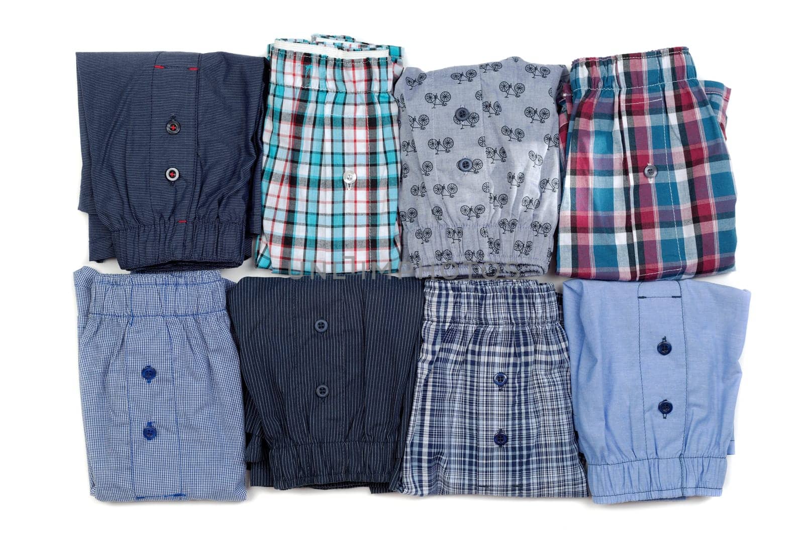 Eight men's briefs folded. Isolate on white.