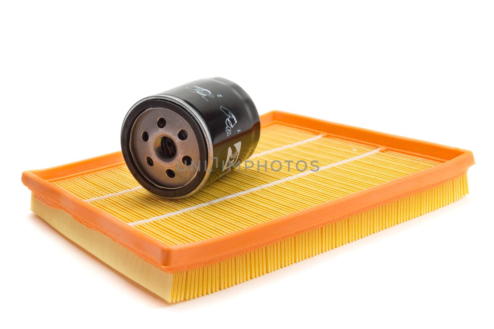 Set of two air filters and oil filter isolated on white.