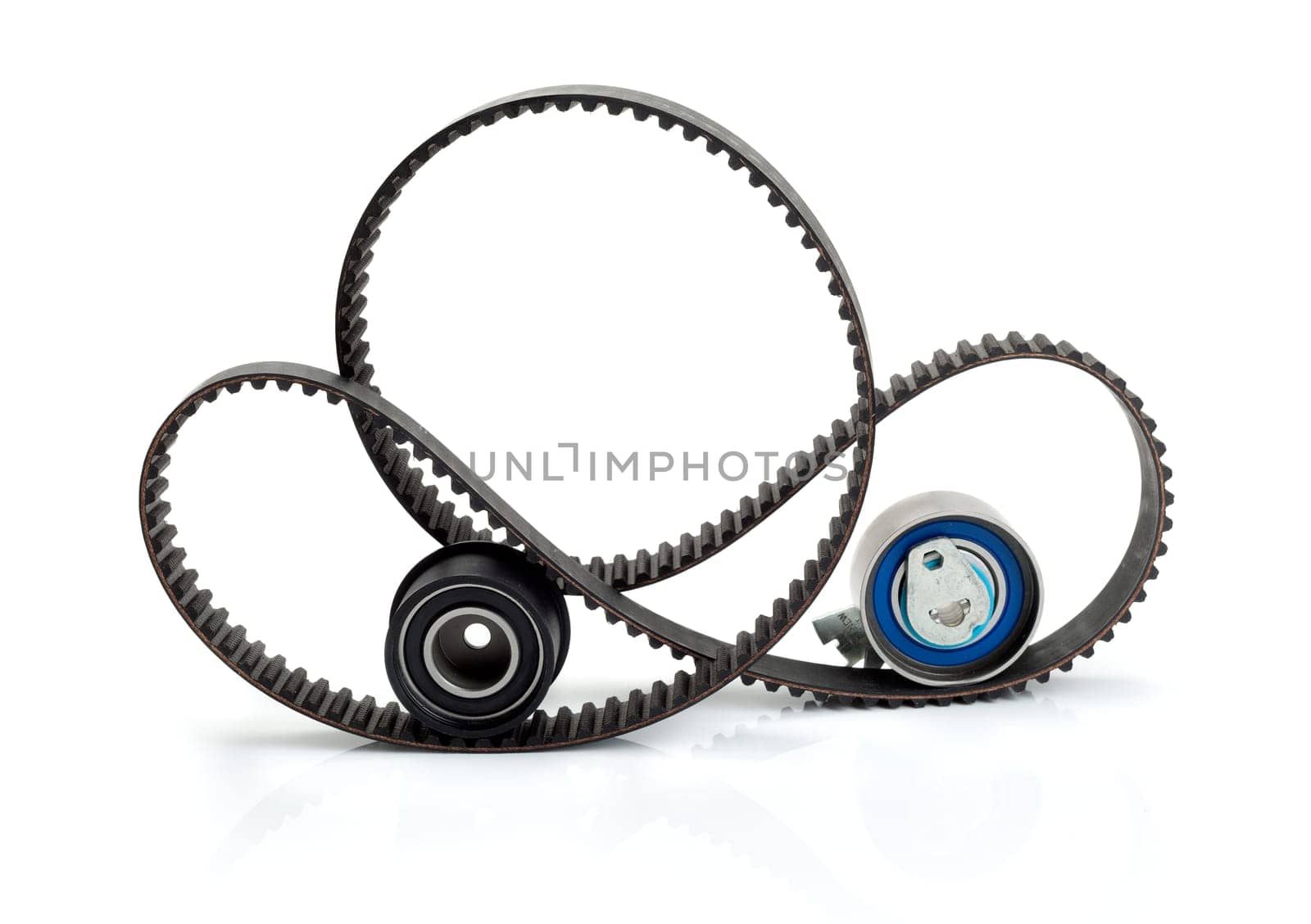 Timing belt, pulley and tensioner. Isolate on white.