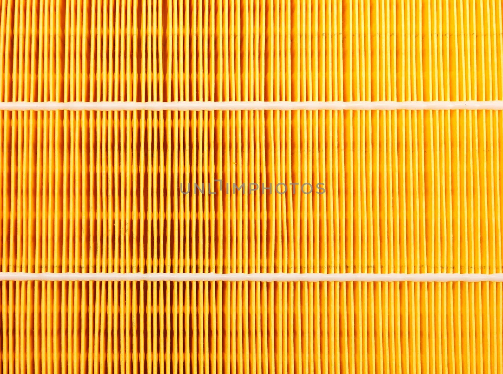 Background of a yellow car air filter closeup.