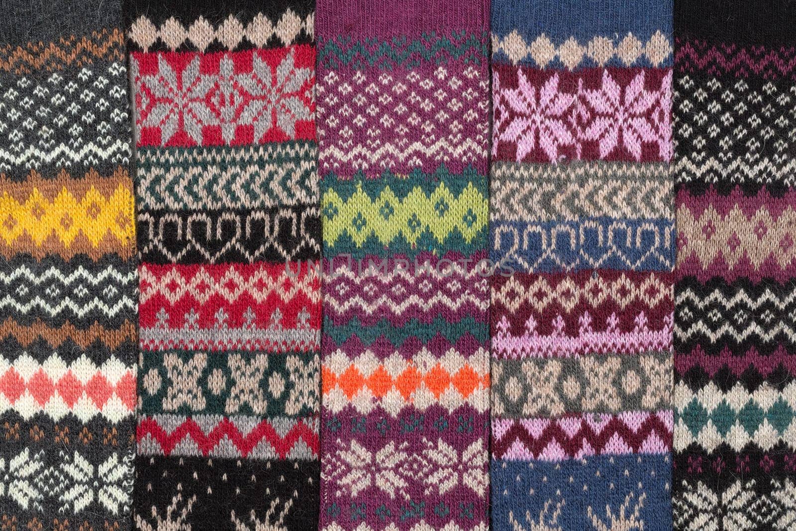 Dark knitted background with the national winter pattern.