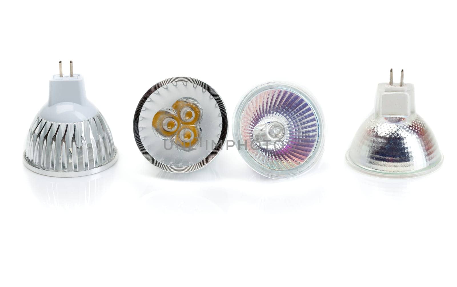 Four lamps MR16 halogen against LEDs. Isolate on white.