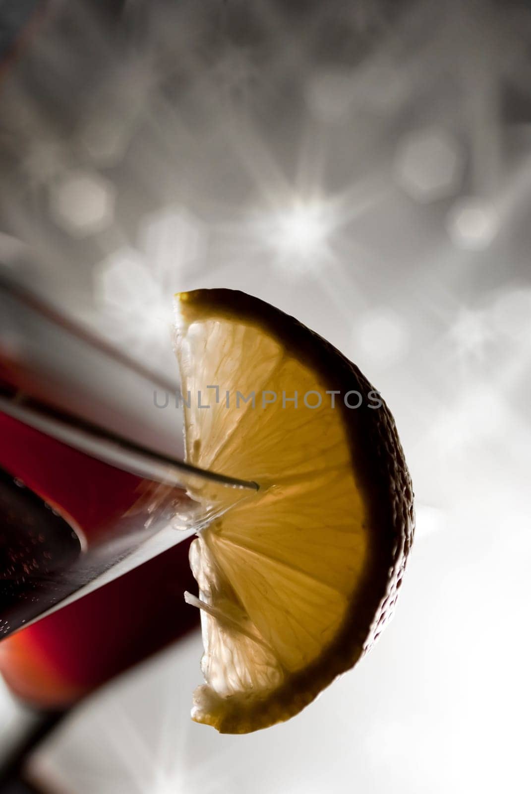 Closeup of martini glass with sparkling background