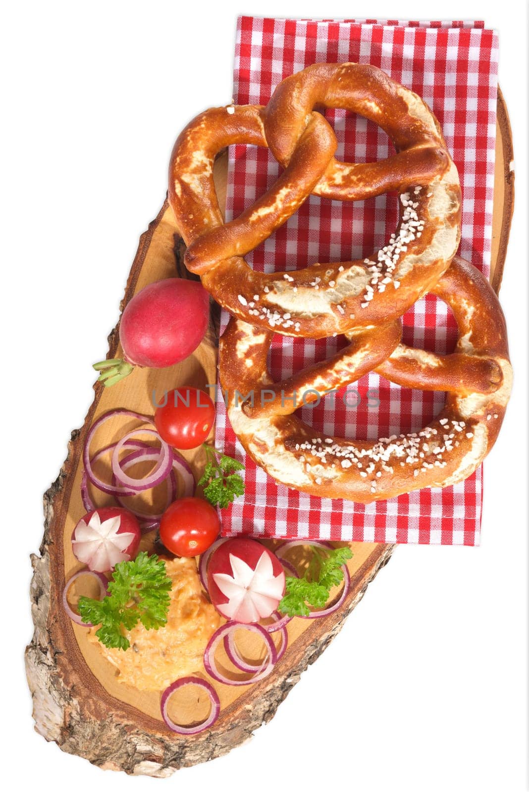 Bavarian vegetarian breakfast with two pretzels and obazda on a white background