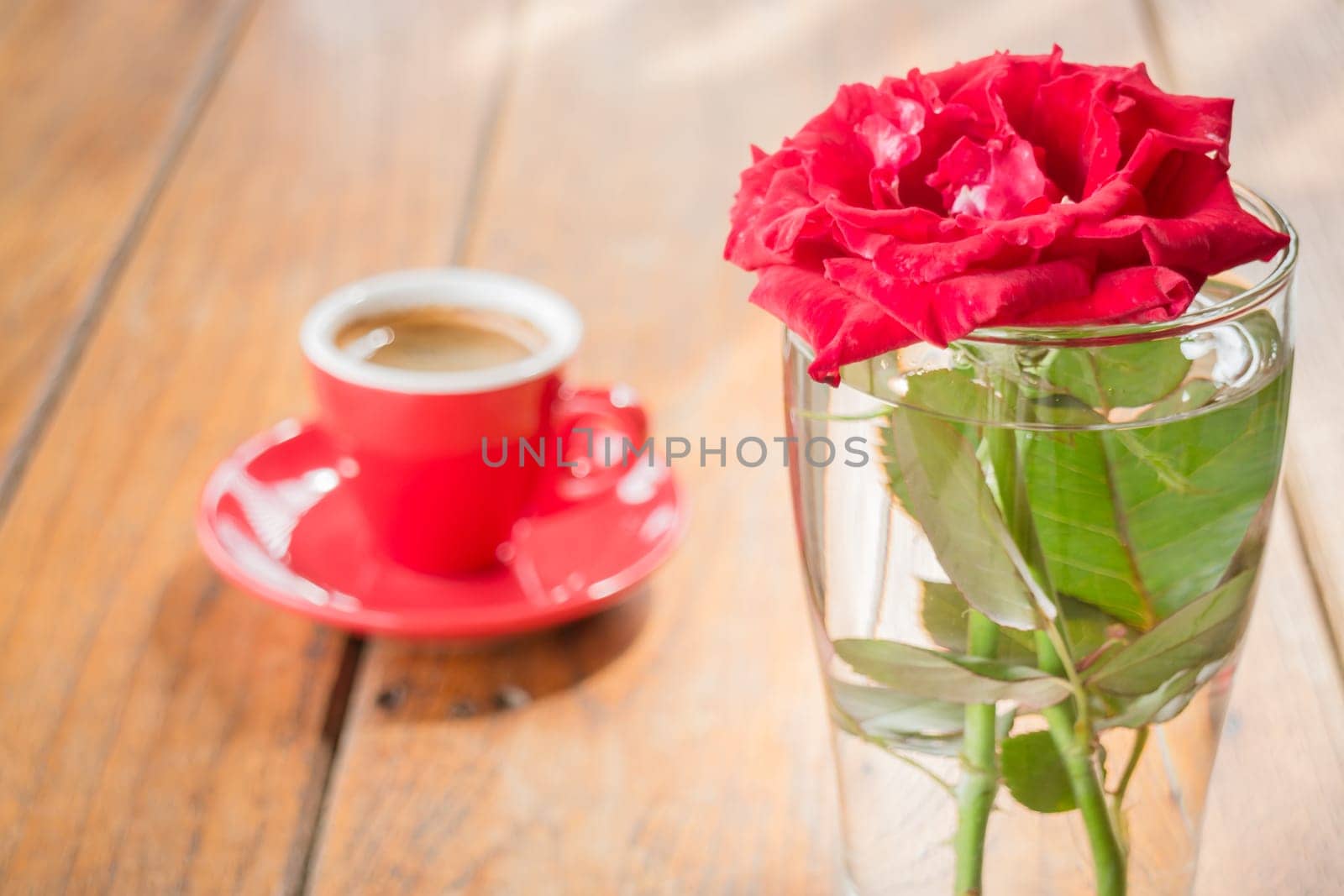 Beautiful table decorated with coffee and red rose, stock photo