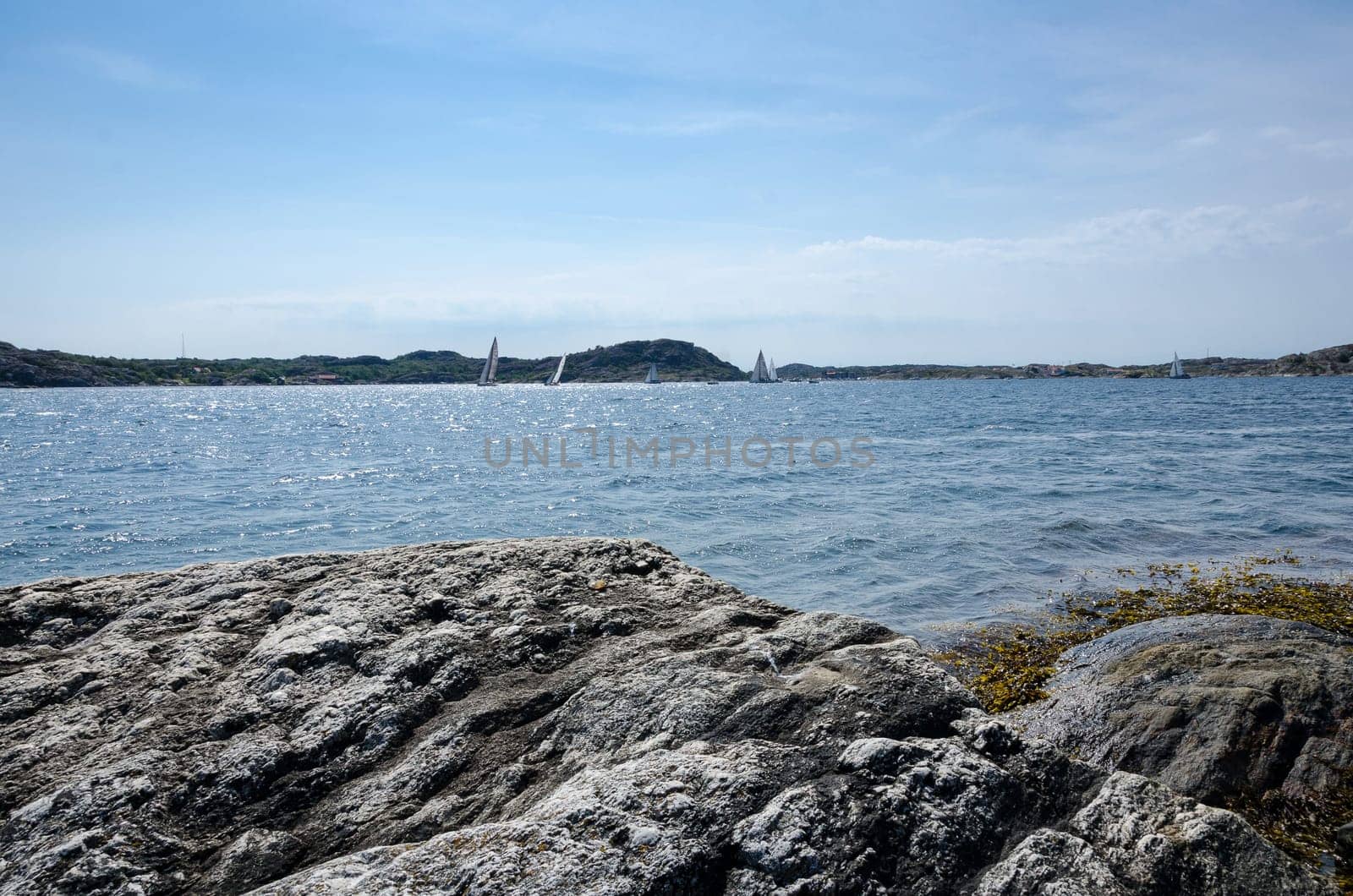swedish westcoast with boat and sunshine and blue sky