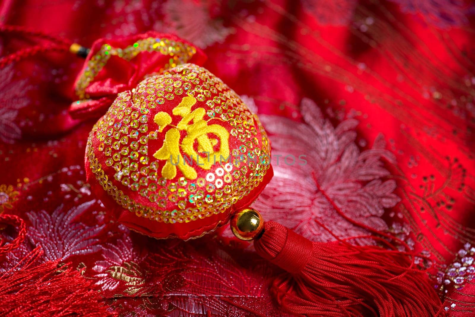 Chinese new year decorations, lucky bag on red background. The Chinese character means "lucky"", not a logo or copyright."