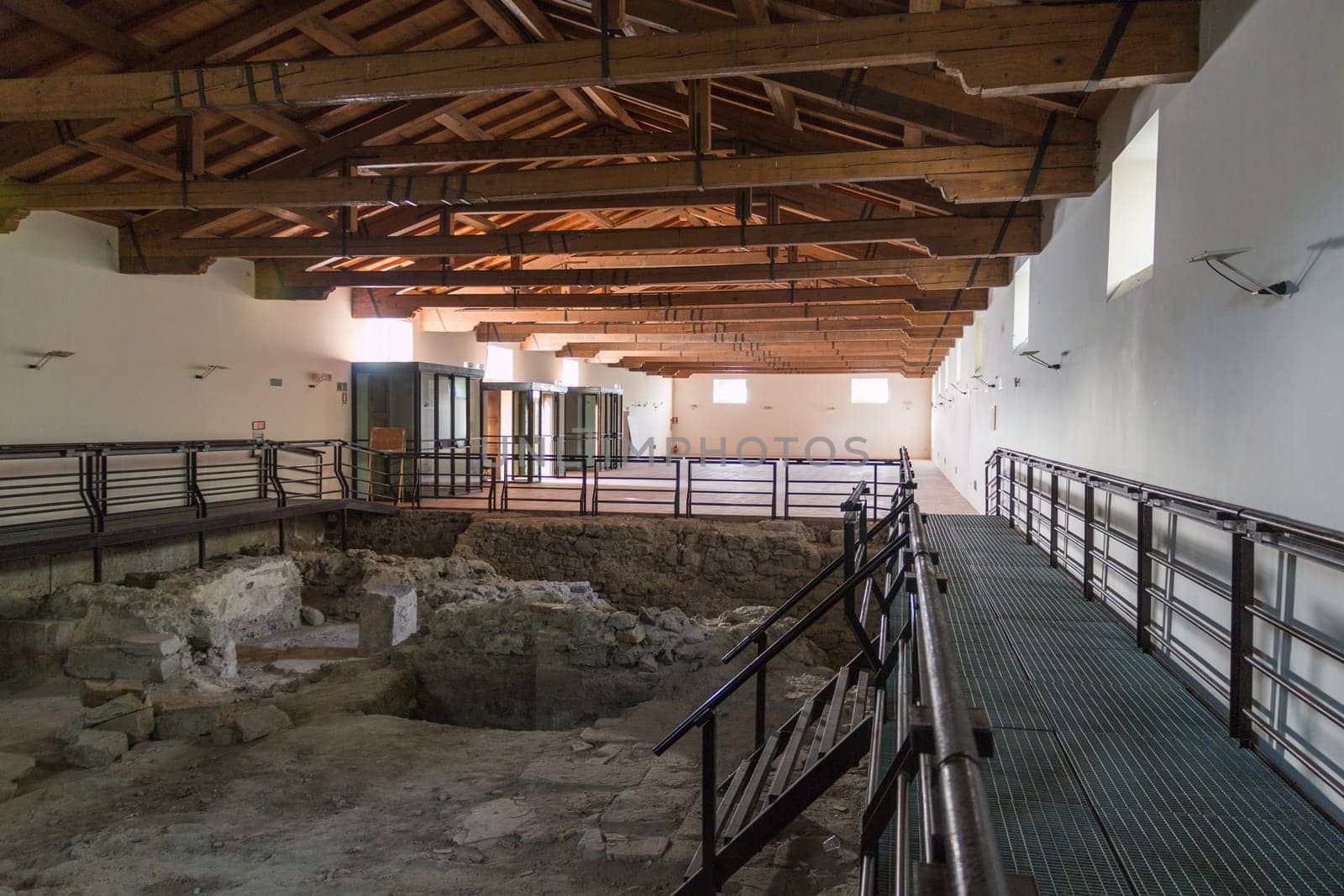 Barn with ancient ruins and roof made of wood