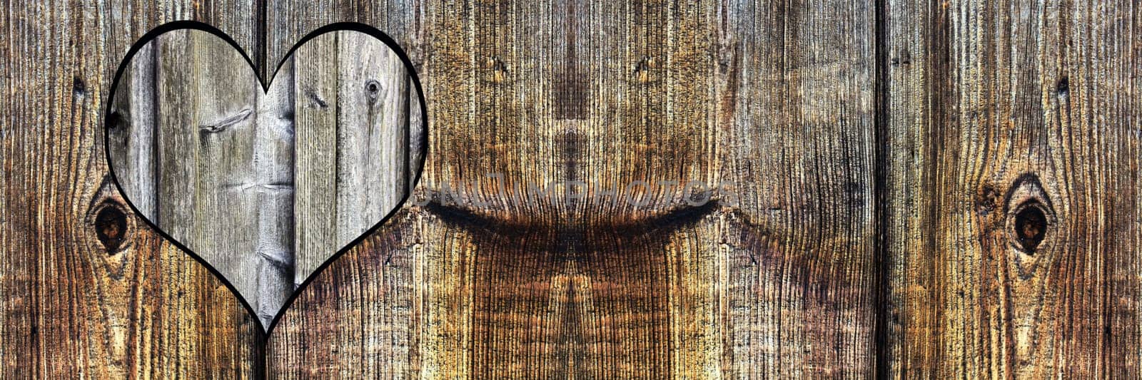 A heart in wood. Background with wood texture
