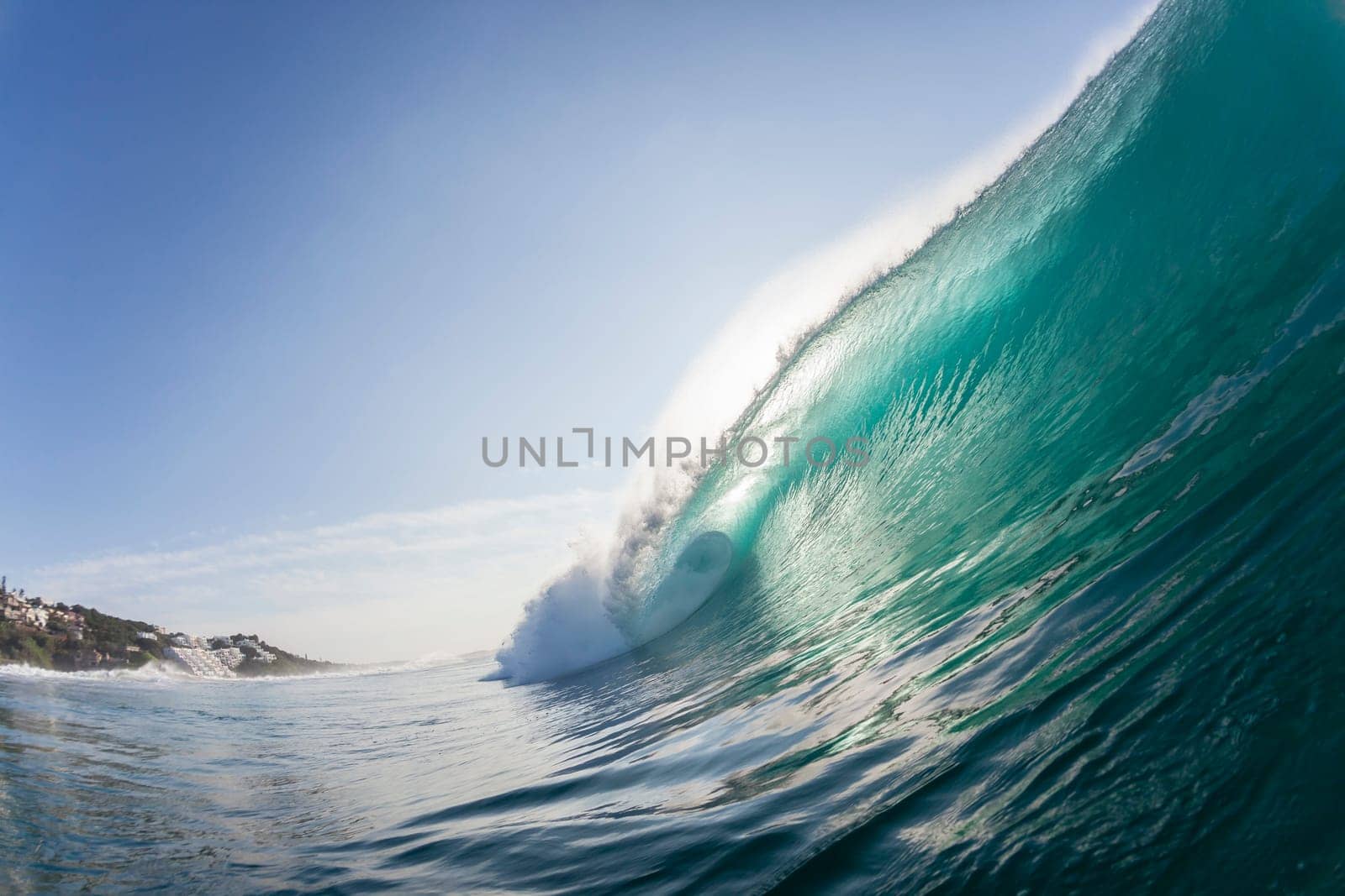 Ocean wave colors of water crashing hollow energy power closeup swimming encounter.