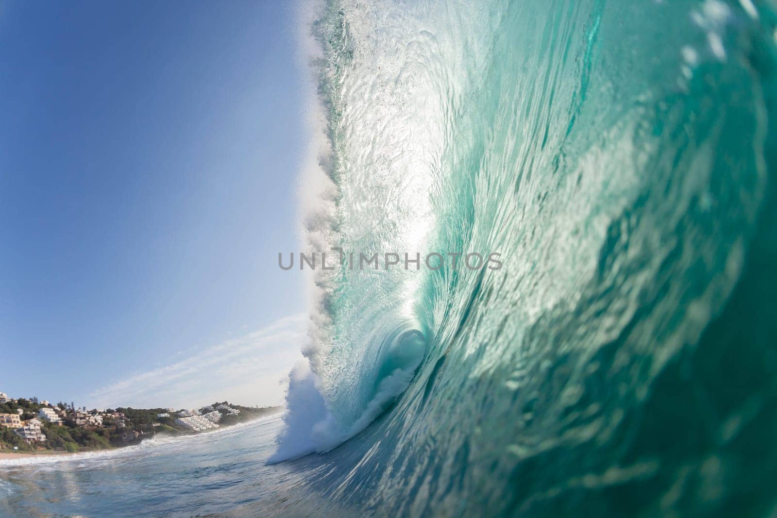 Ocean wave colors of water crashing hollow energy power closeup swimming encounter.