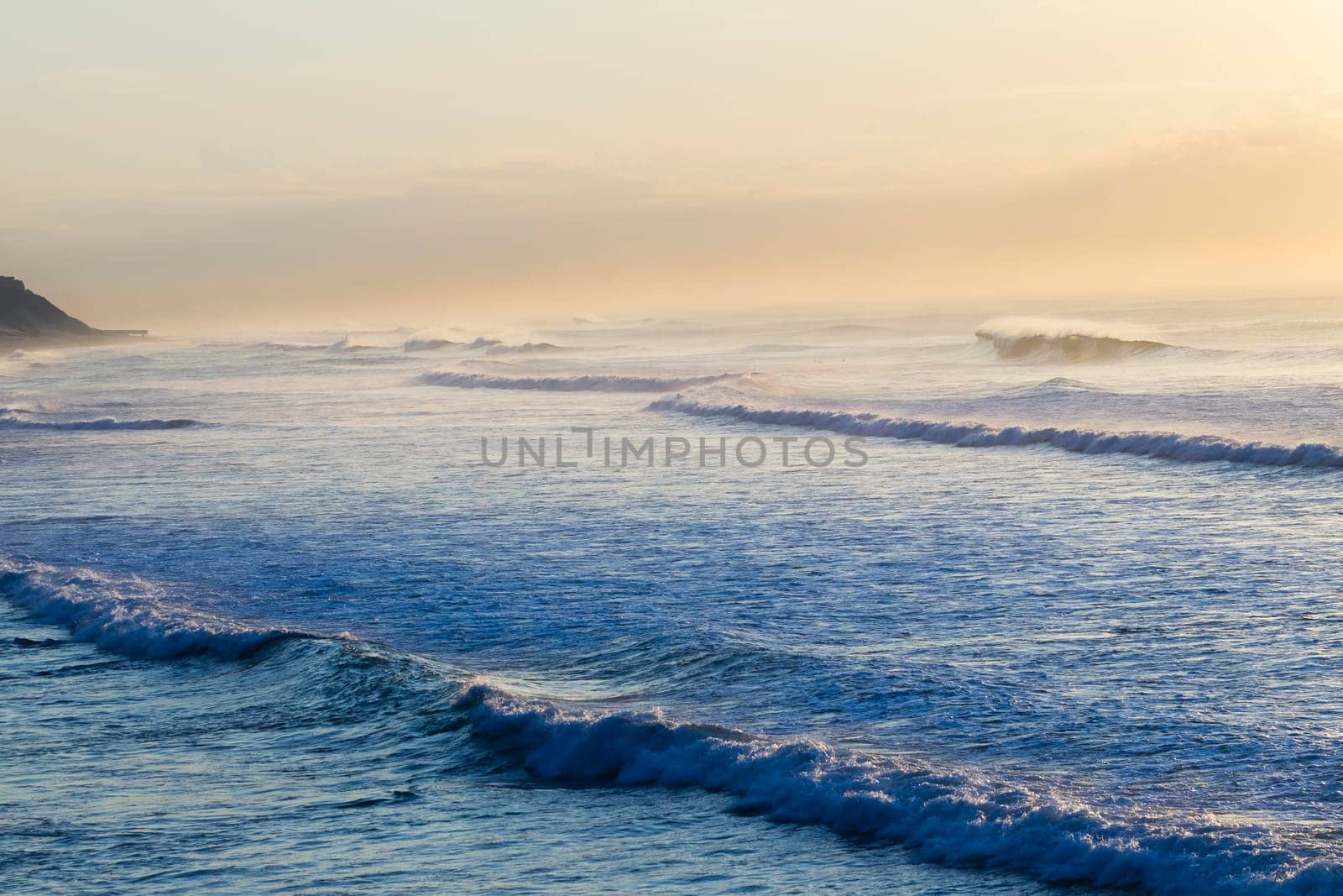 Ocean wave swells crashing water power coastline landscape.