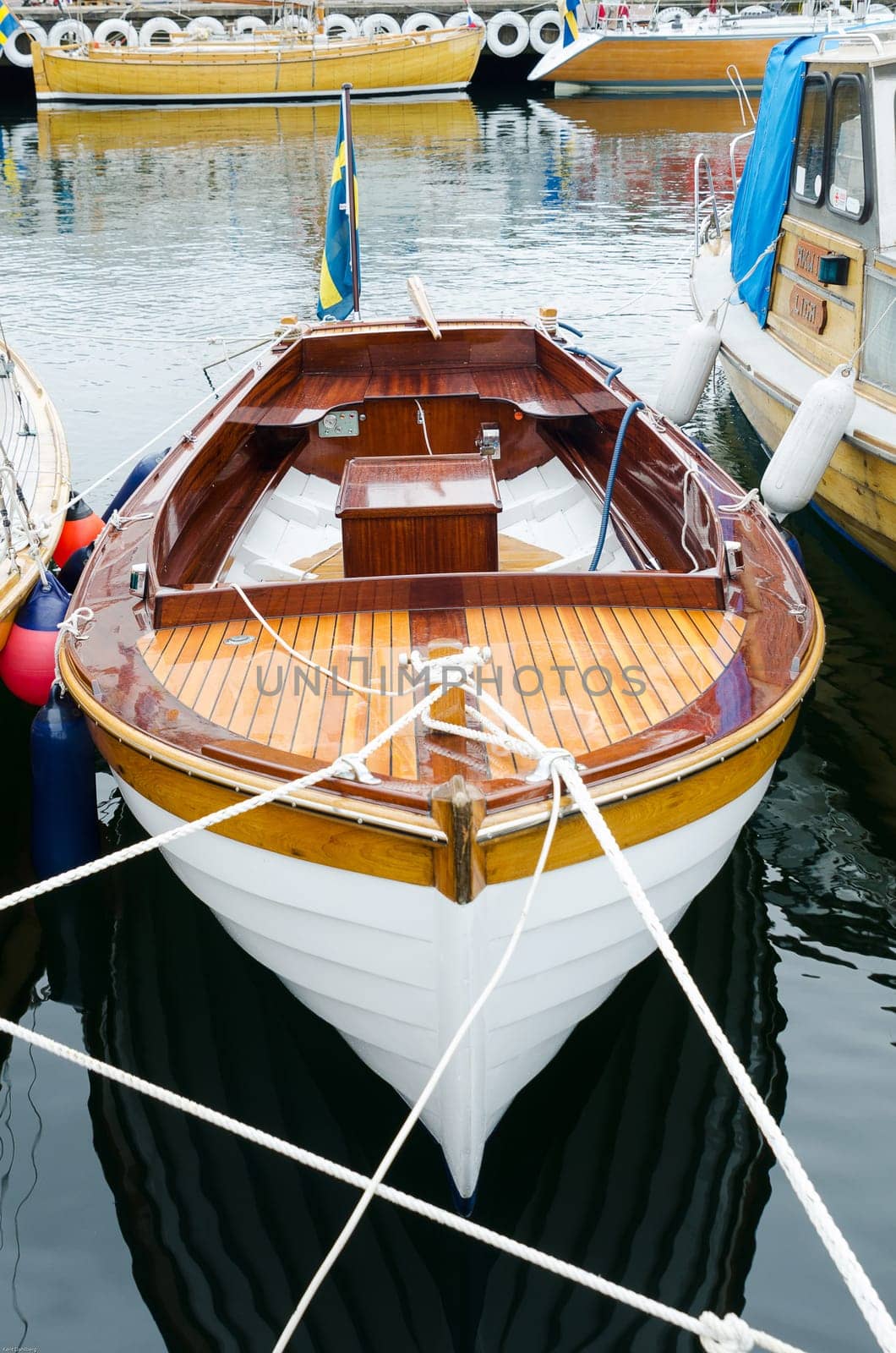 old beutiful open boat with motor and flag and shining