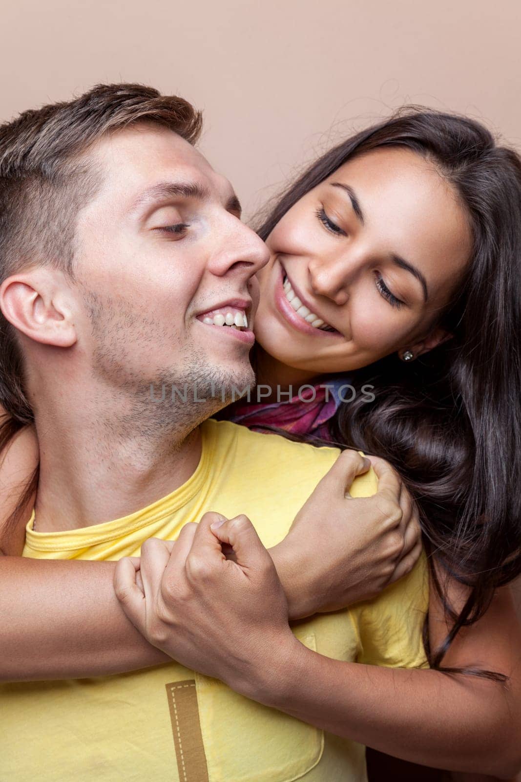 Young happy couple in love smiling