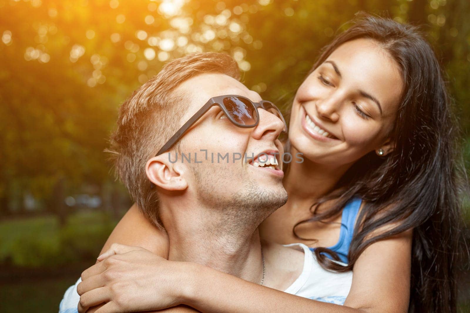 Young happy couple in love having a goot time outdoors