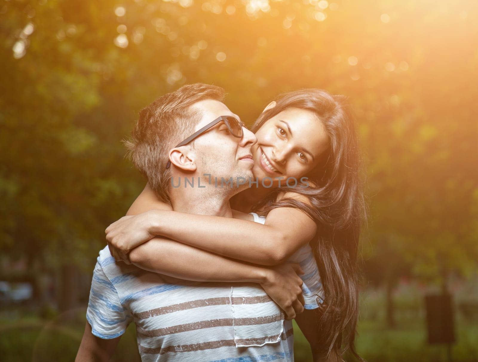 Young happy couple in love having a goot time outdoors