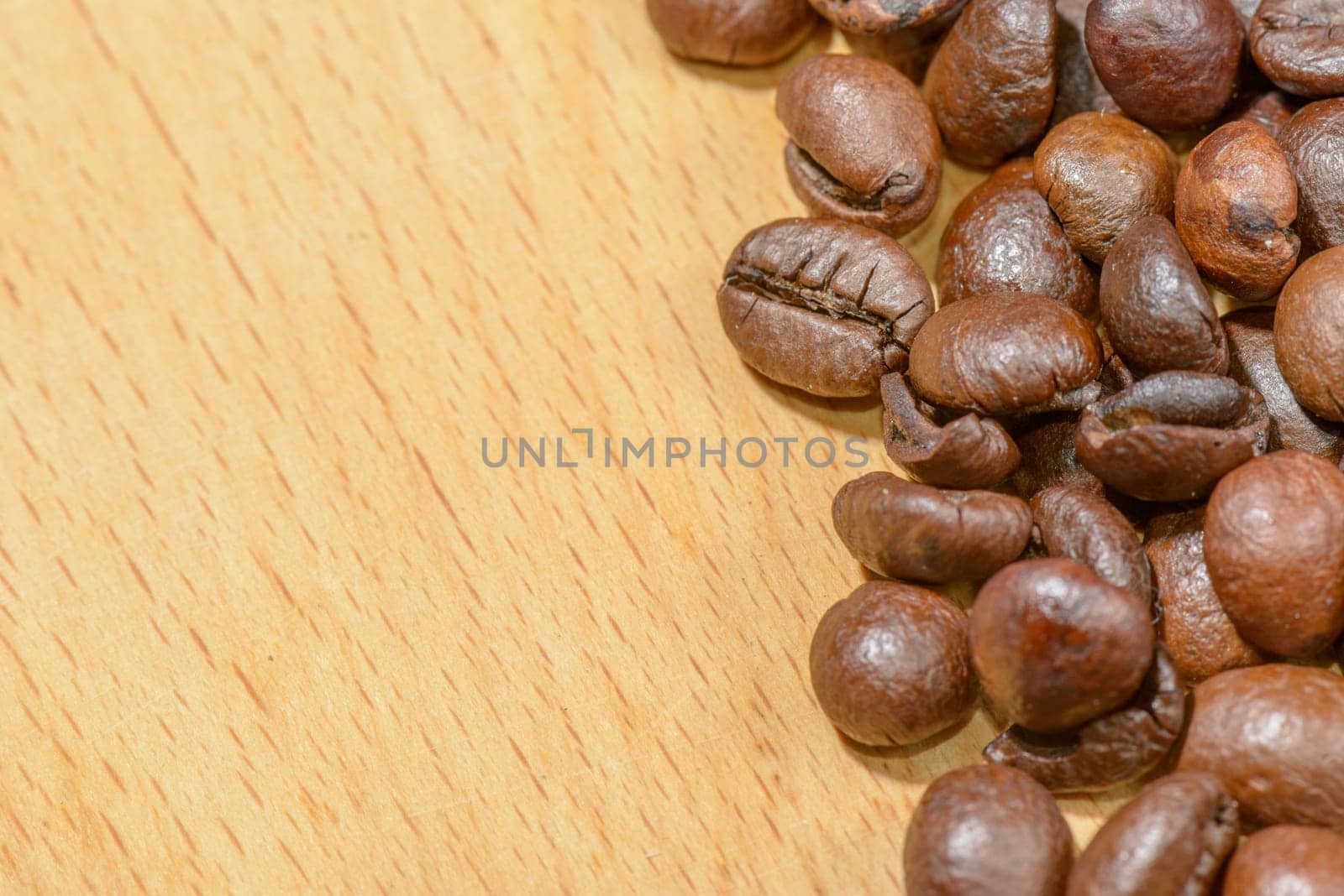 Macro of several toasted coffee seeds