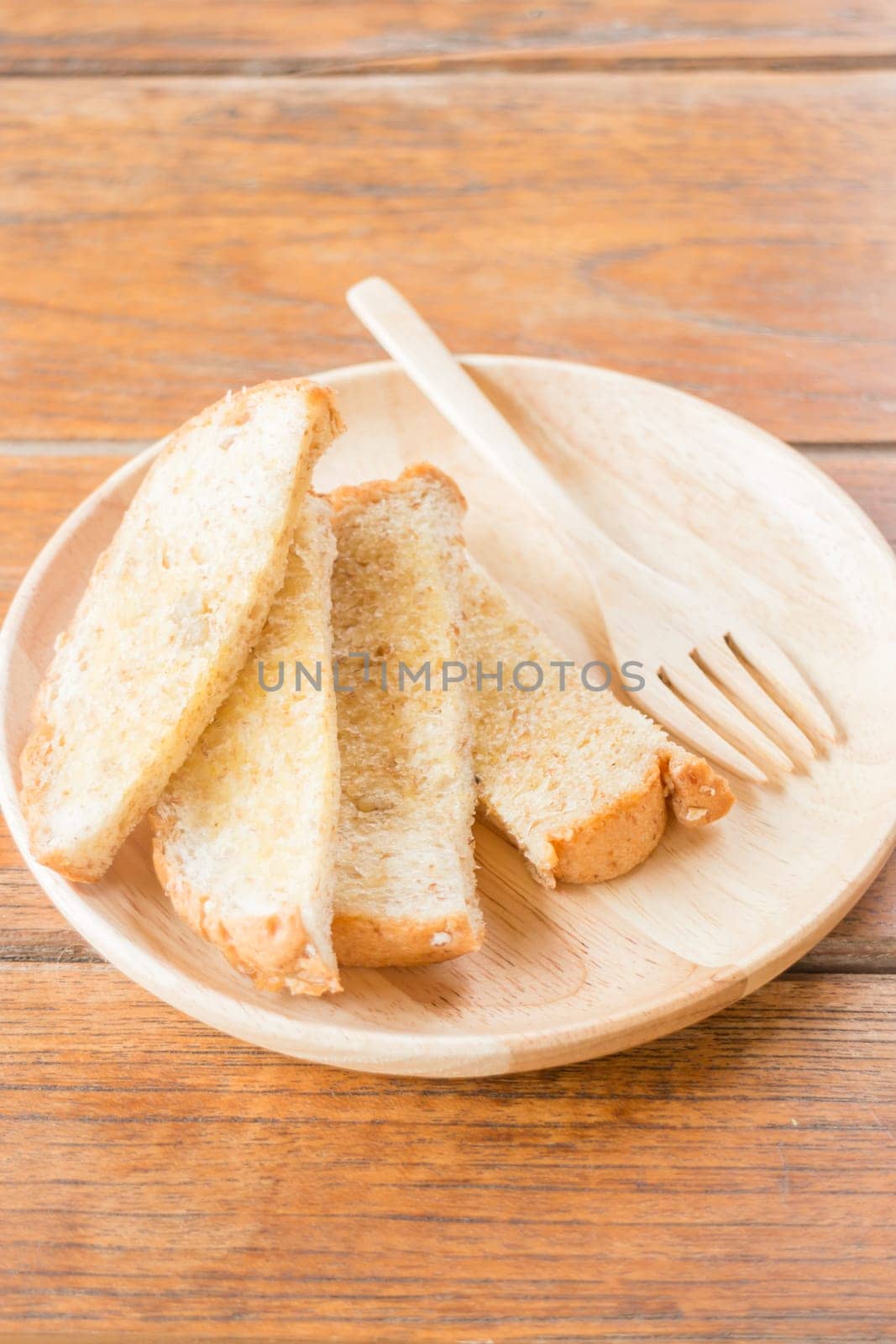 Tasty toasted multi grain bread with butter, stock photo