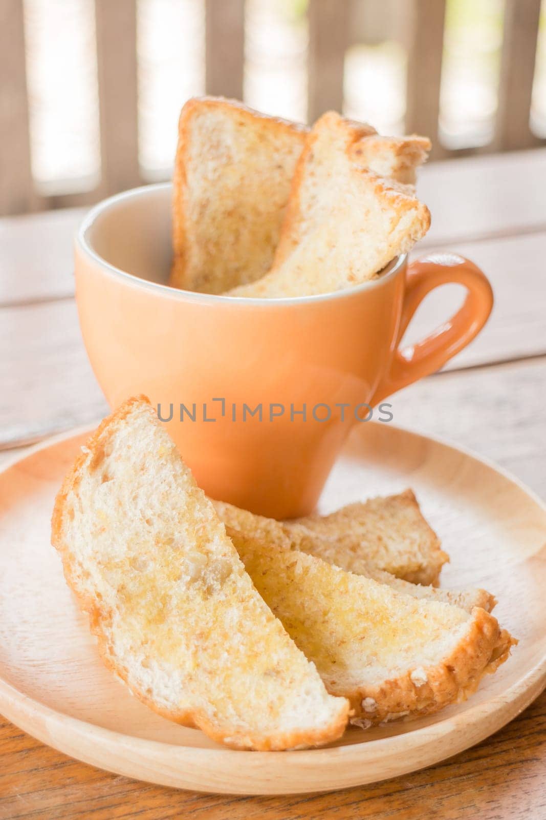 Tasty toasted multi grain bread with butter, stock photo