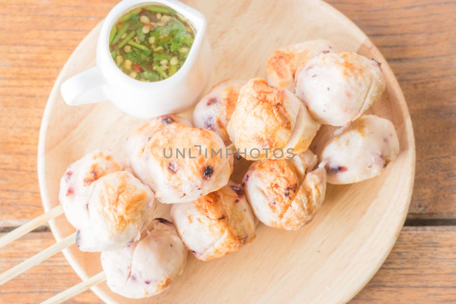 Squid grilled ball on wooden plate, stock photo