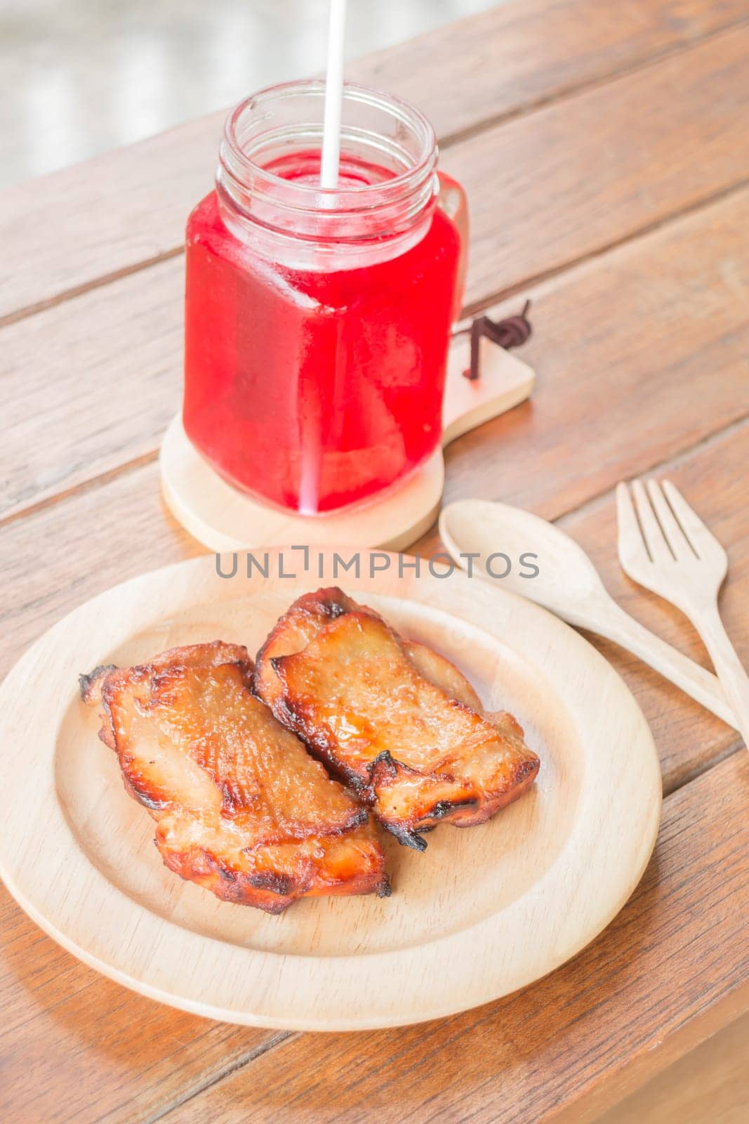 Chicken grilled steak on wooden plate, stock photo