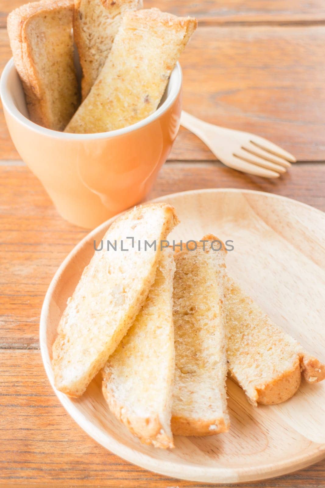 Tasty toasted multi grain bread with butter, stock photo