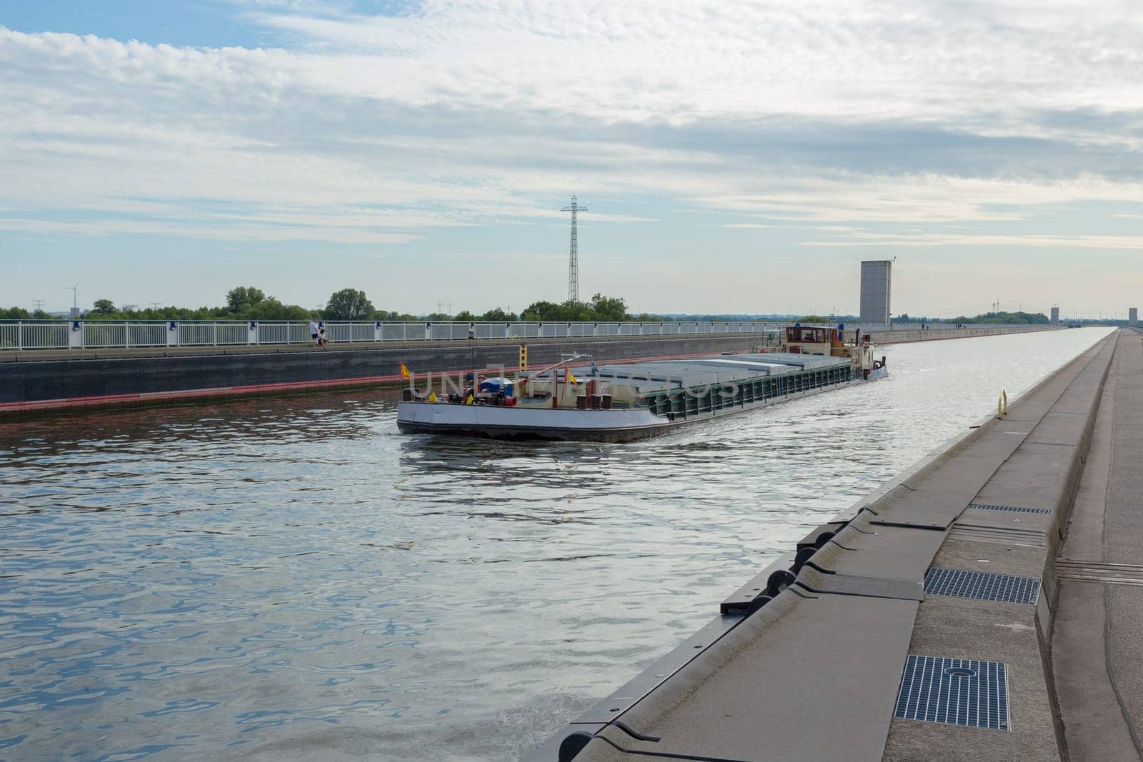 Cargo ship on the bridge of the Elbe-Havel Canal over the Elbe near Magdeburg