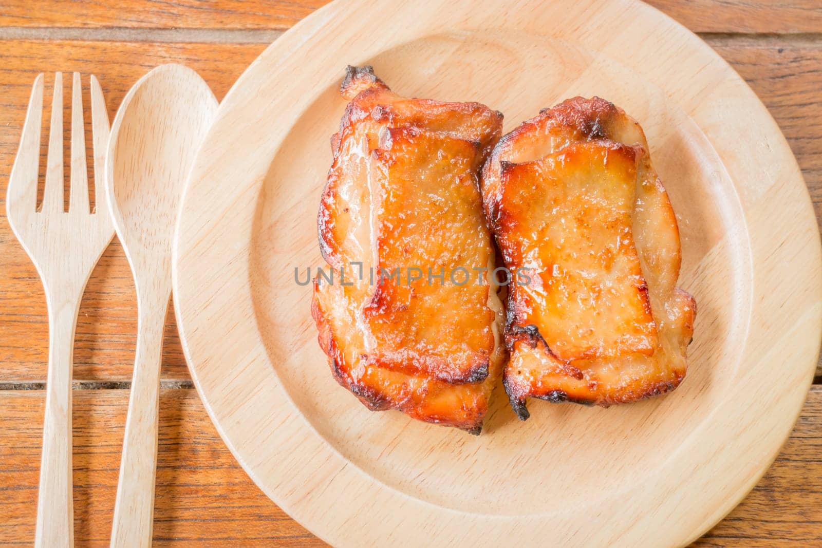 Chicken grilled steak on wooden plate, stock photo