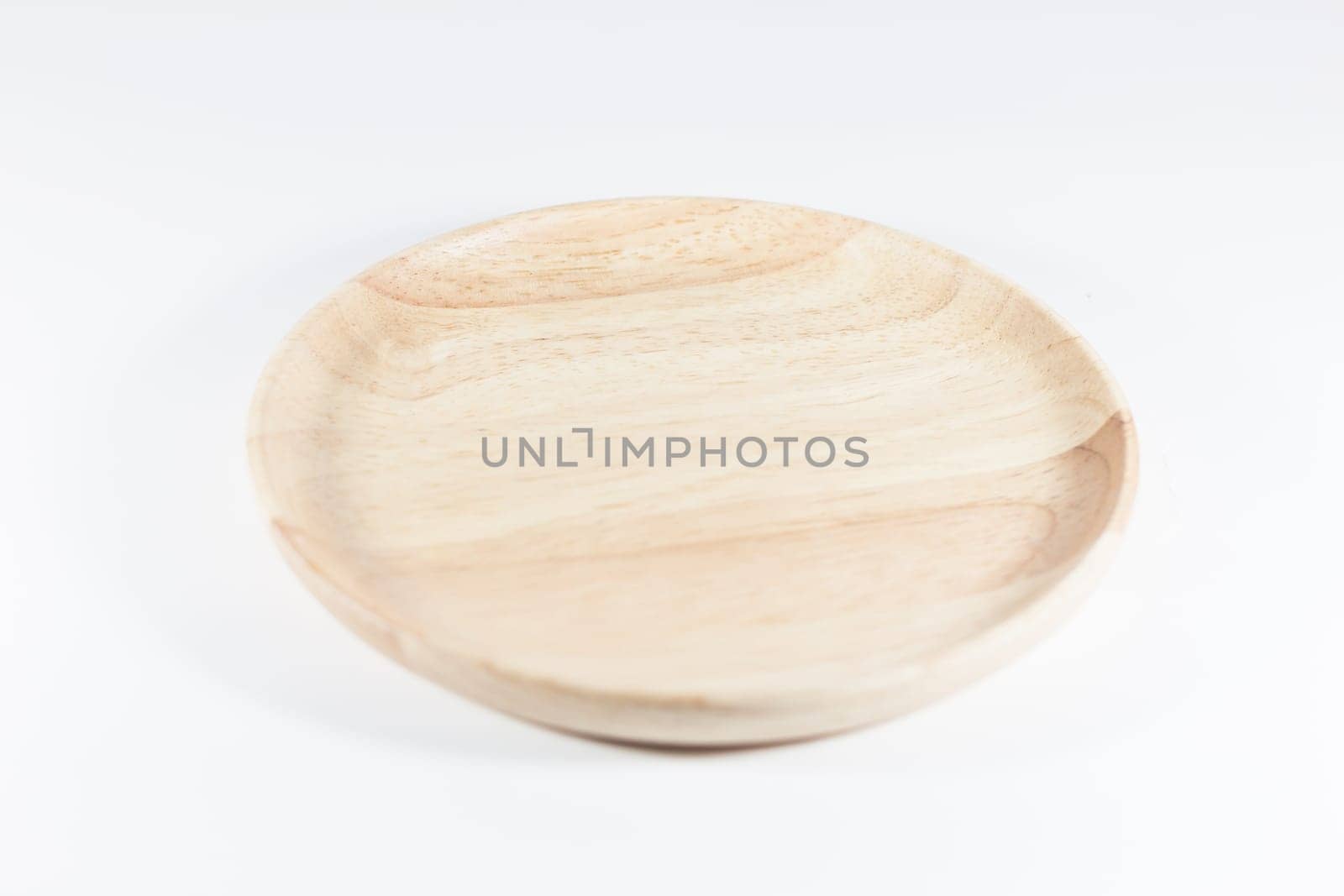 Wooden plate isolated on white background, stock photo