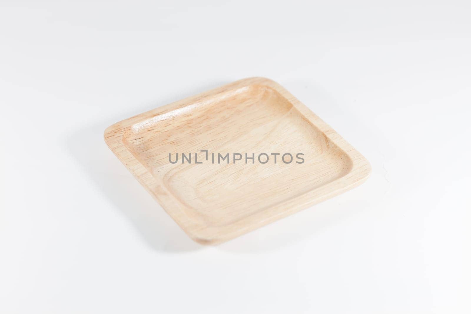 Wooden plate isolated on white background, stock photo