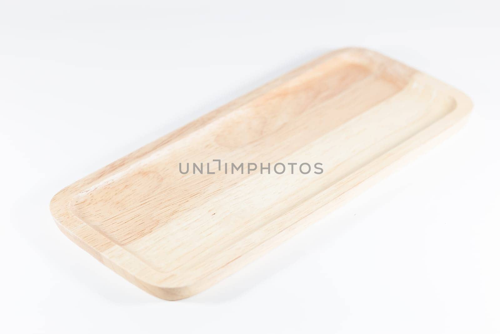 Wooden plate isolated on white background, stock photo