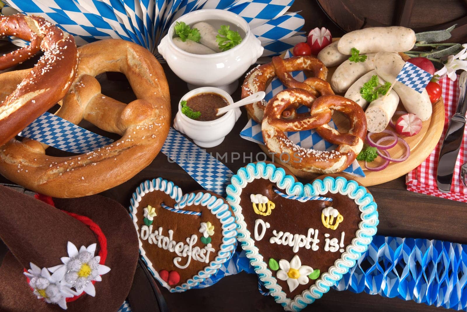 Many typical Bavarian dishes in one picture. Pretzels,gingerbread and white sausage.