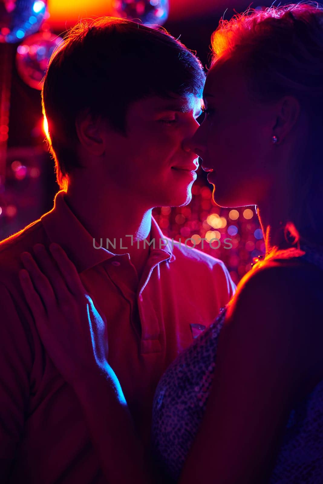 Romantic couple dancing in night club