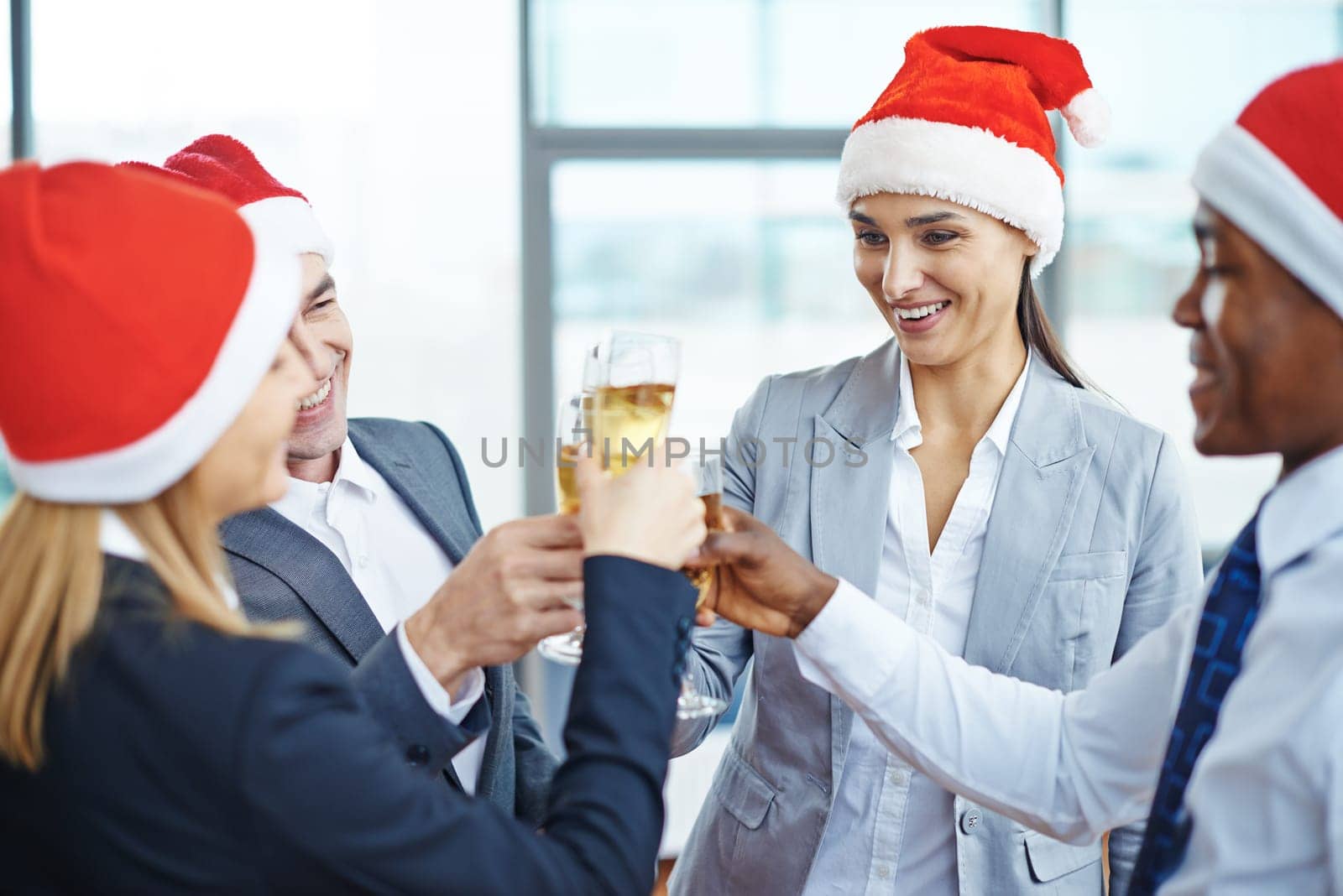 Happy colleagues toasting with champagne