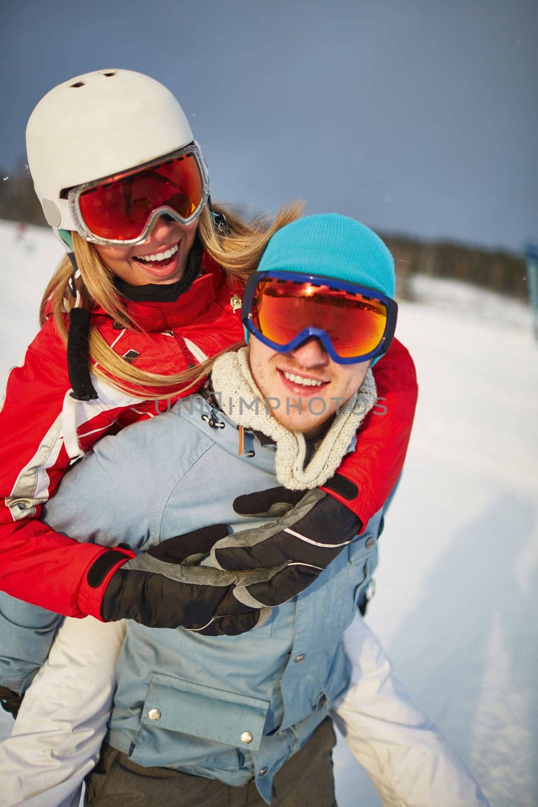 Affectionate couple in winter sportswear enjoying their vacation