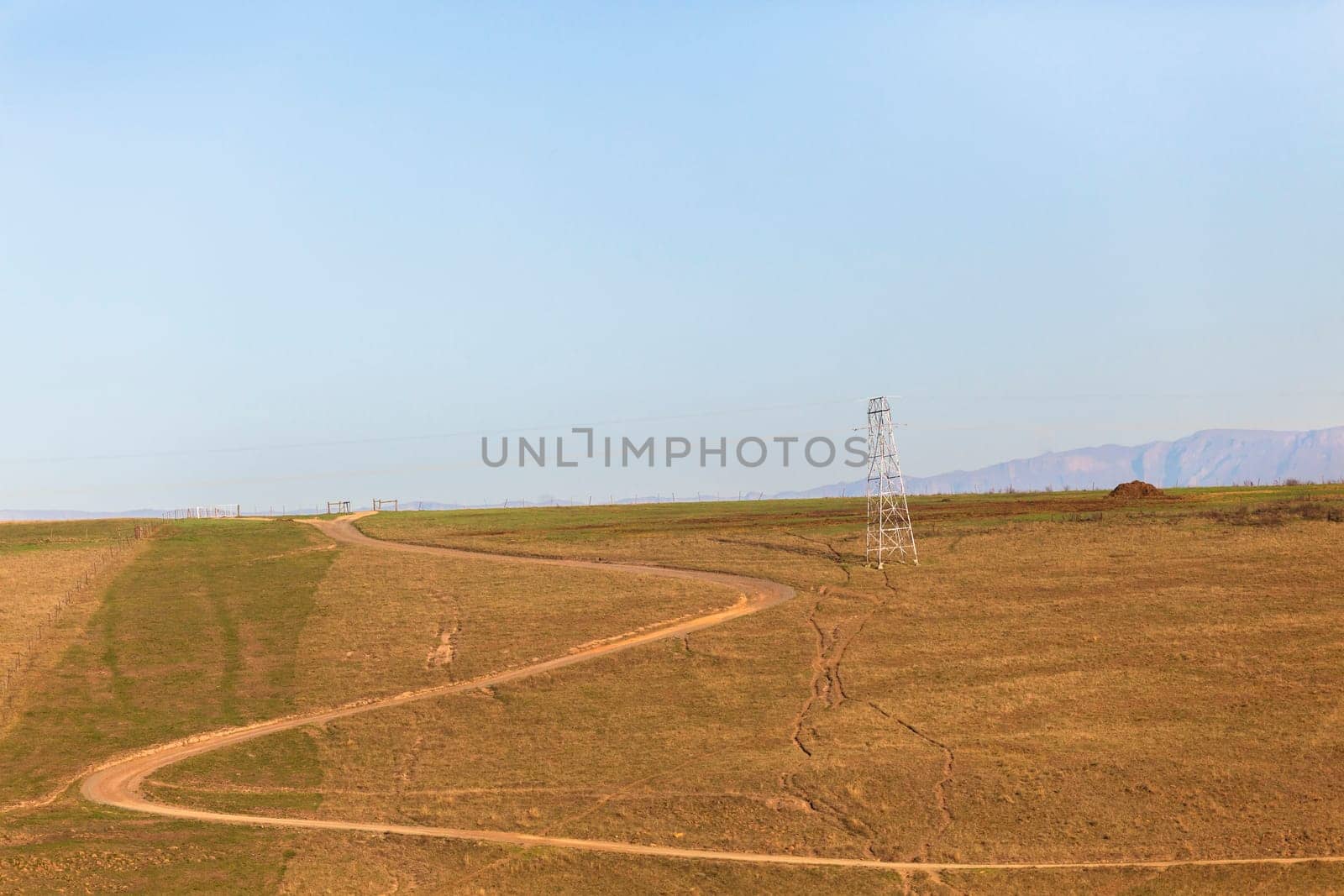 Dirt road dry season in rural farming mountain landscape