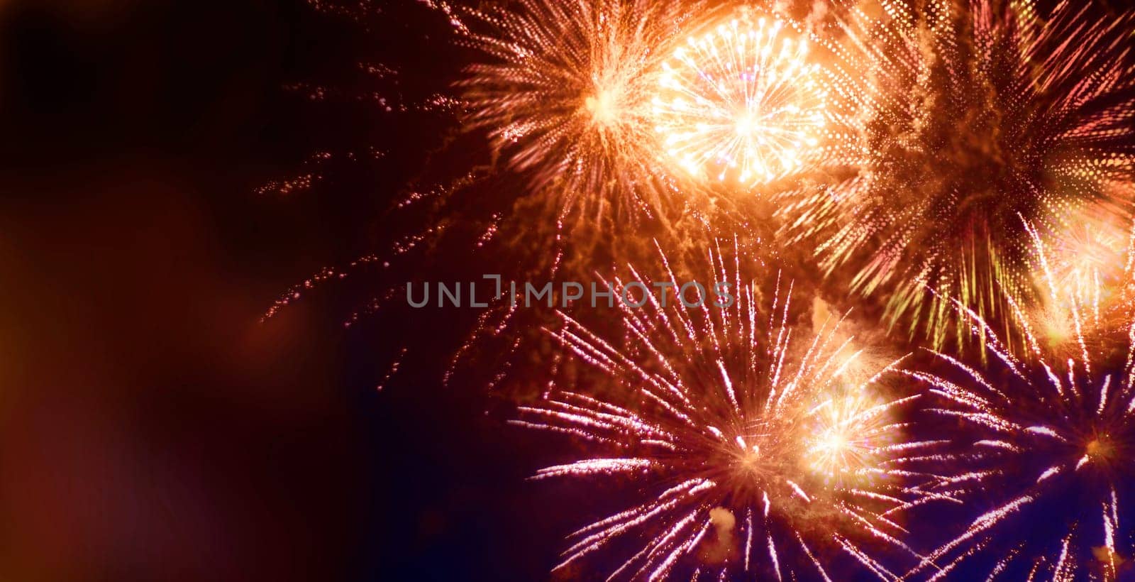 nightly fireworks with light and glitter patterns,graphic star shapes with motion blur added