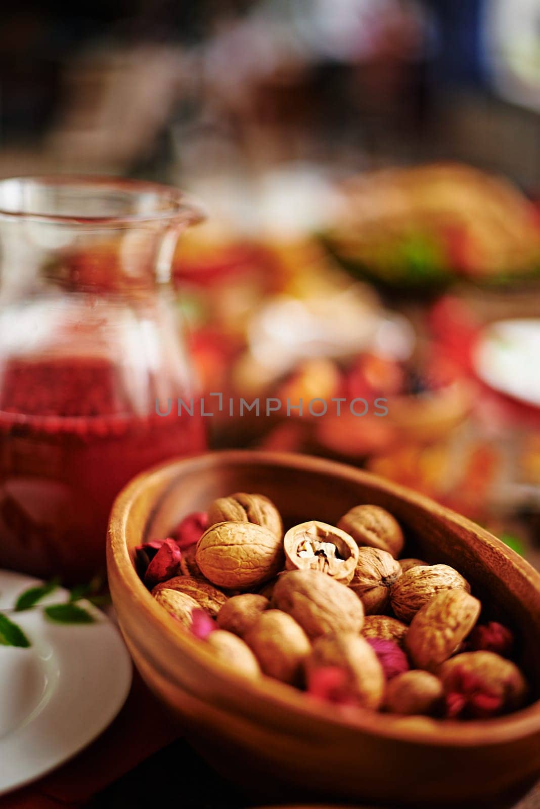 Walnuts in wooden bowl on festive table