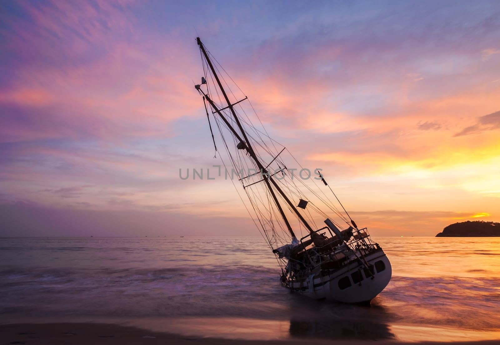 Boat on the beach side with color of sunset