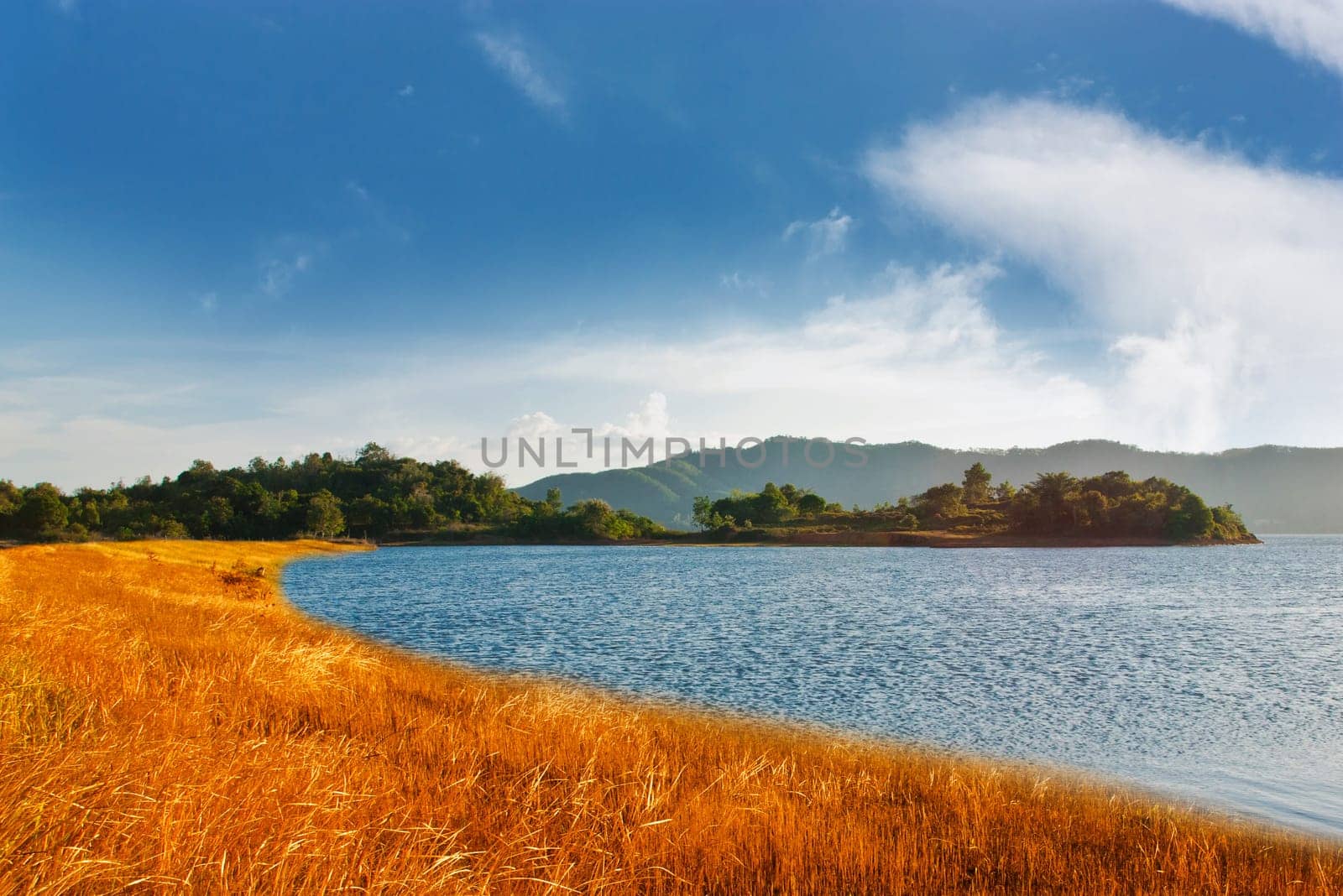 Beautiful of blue sky with yellow grass and river in color of sunlight