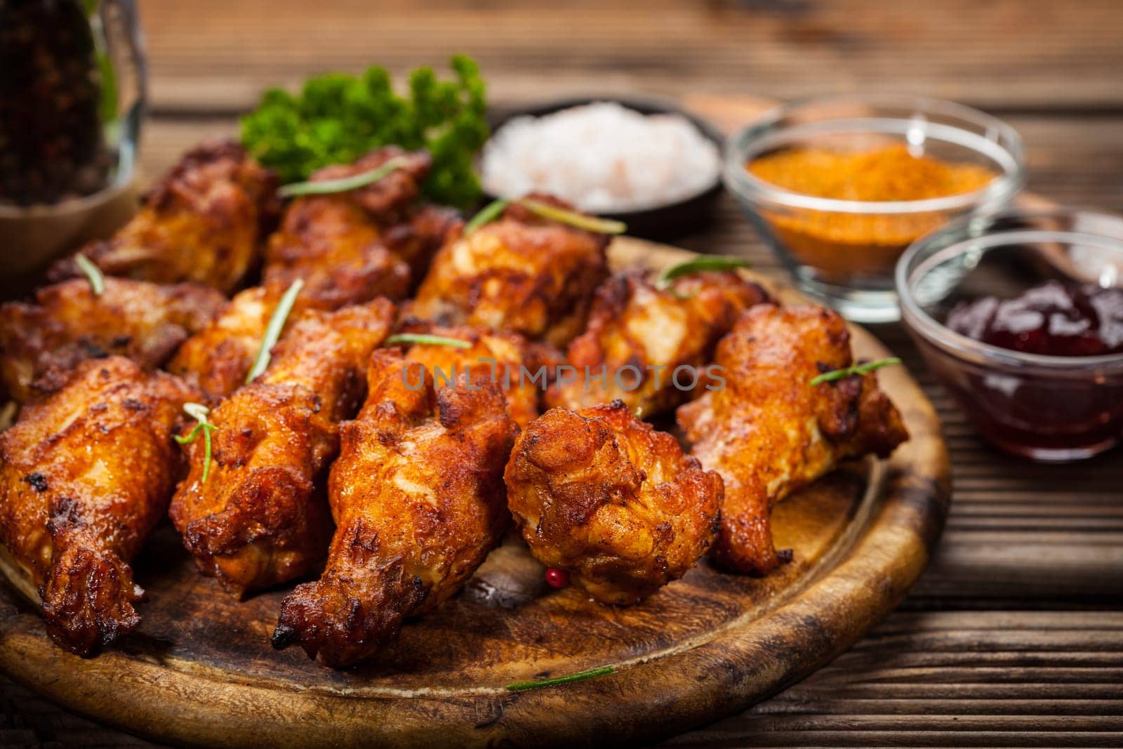BBQ chicken wings with spices and dips