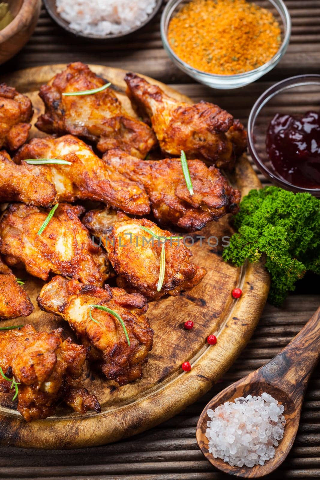 BBQ chicken wings with spices and dips