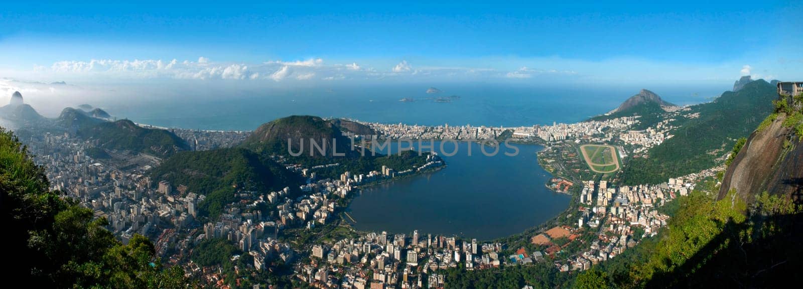 Panoramic view of Rio De Janeiro, sky, city and seashore view from Christ the Redeemer. Brazil landscape.