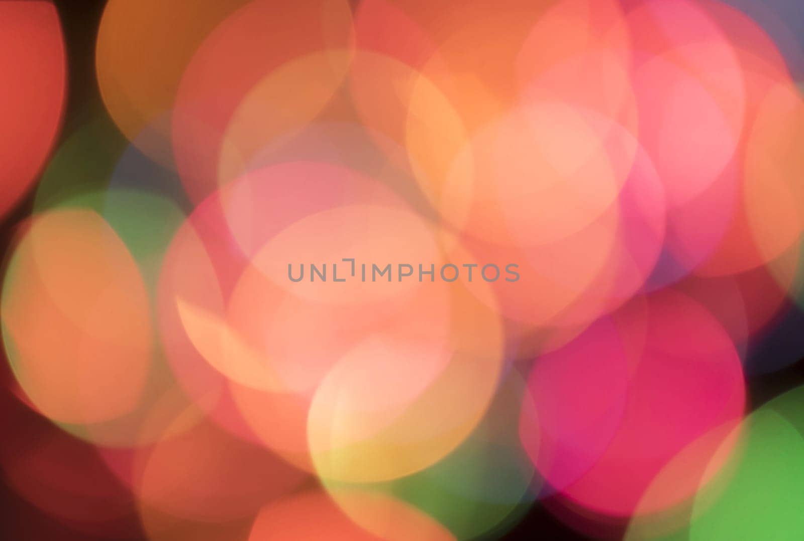 Out of focus christmas lights in various colors.